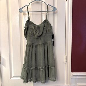 Strappy green decorative dot print fabric sundress.